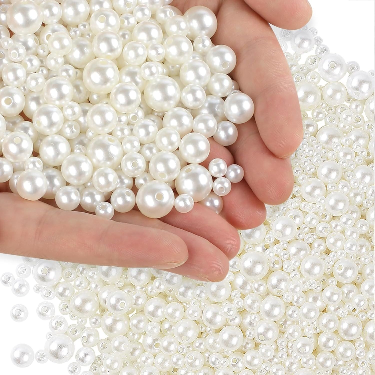 An elegant flat lay of finished pearl and gold jewelry pieces